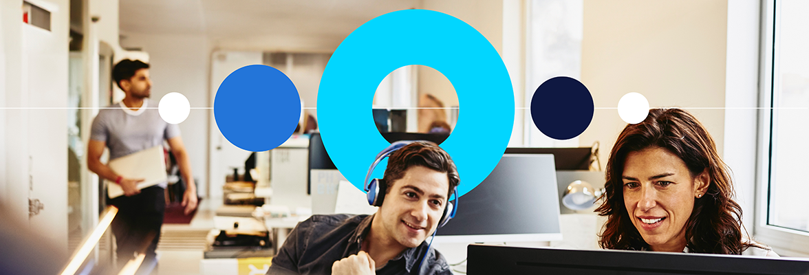 Two people using a laptop in Randstad office