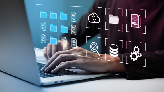 Hands on a laptop keyboard displaying digital icons