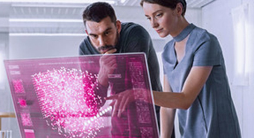 A woman and a man look at a virtual screen together